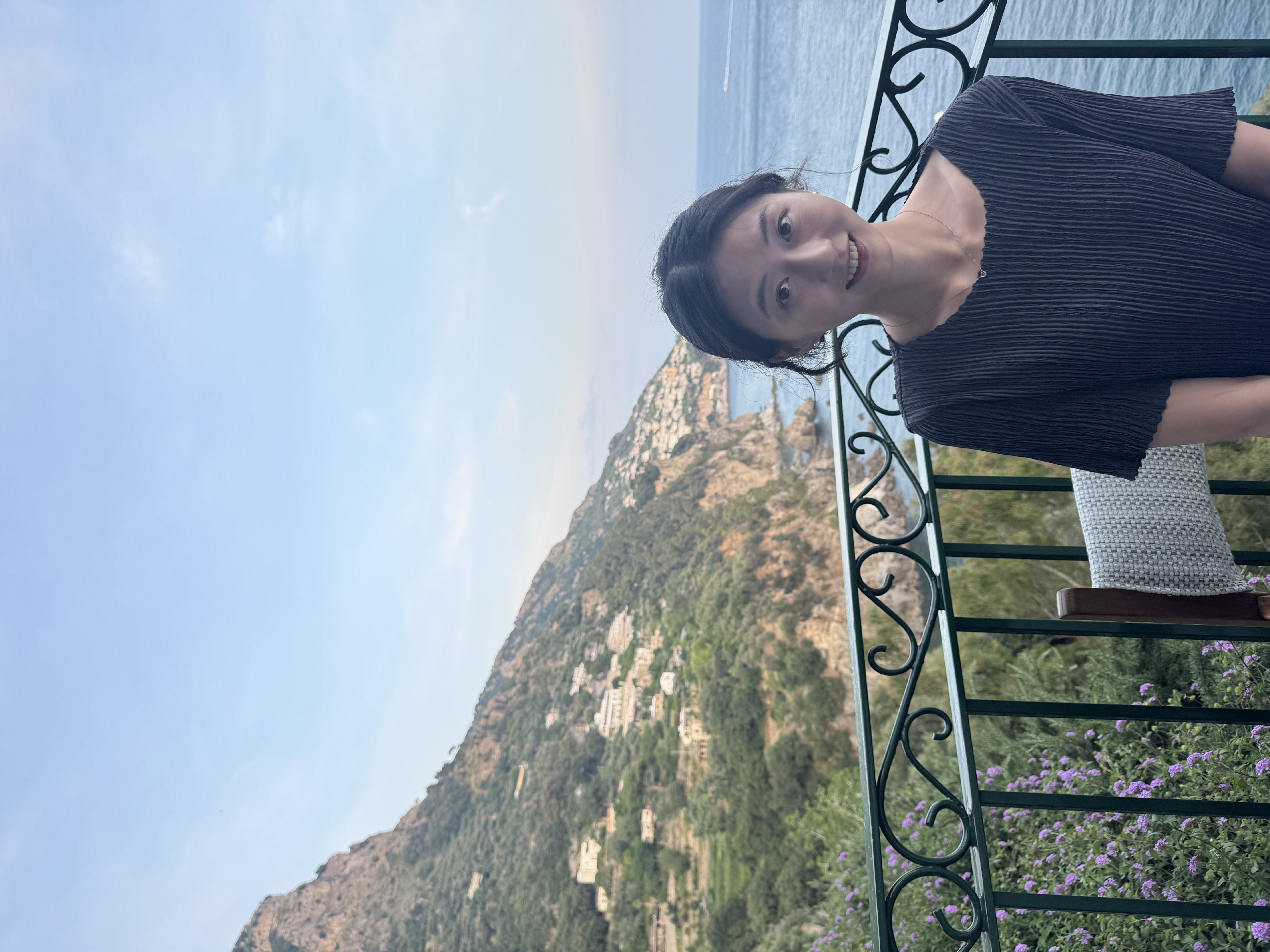 Joanne Jang on a seaside terrace